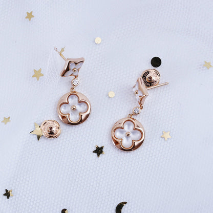 [NOVO]Ohrringe mit Stern und Sonne in Rosa-Gold