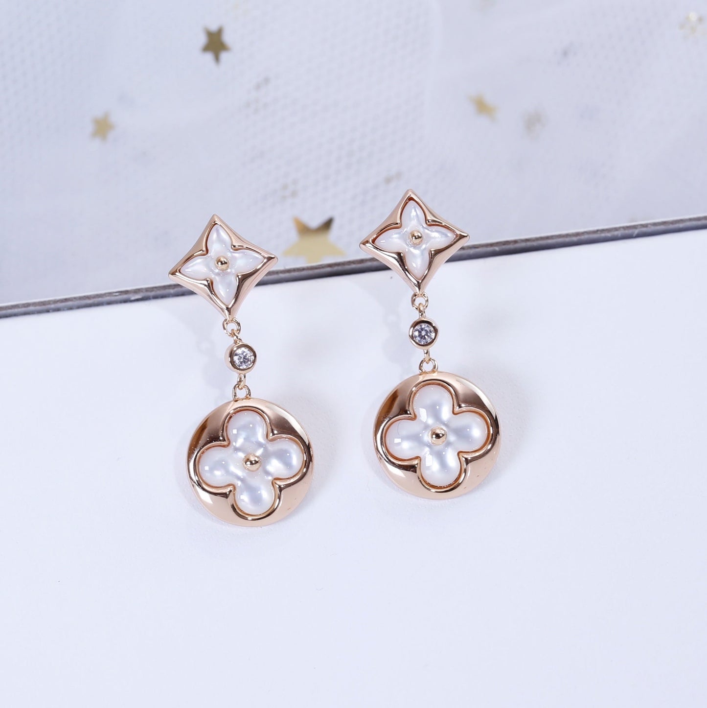 [NOVO]Ohrringe mit Stern und Sonne in Rosa-Gold