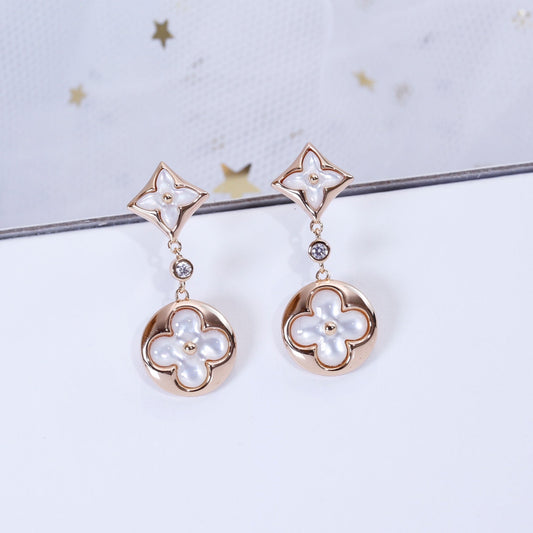 [NOVO]Ohrringe mit Stern und Sonne in Rosa-Gold