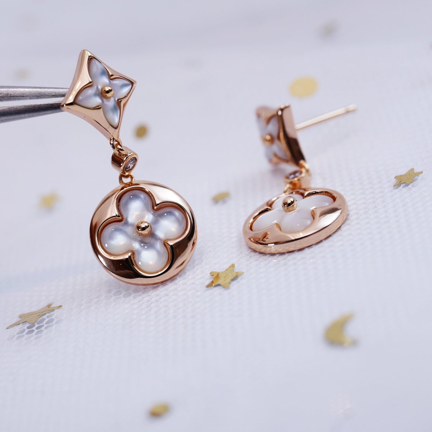[NOVO]Ohrringe mit Stern und Sonne in Rosa-Gold