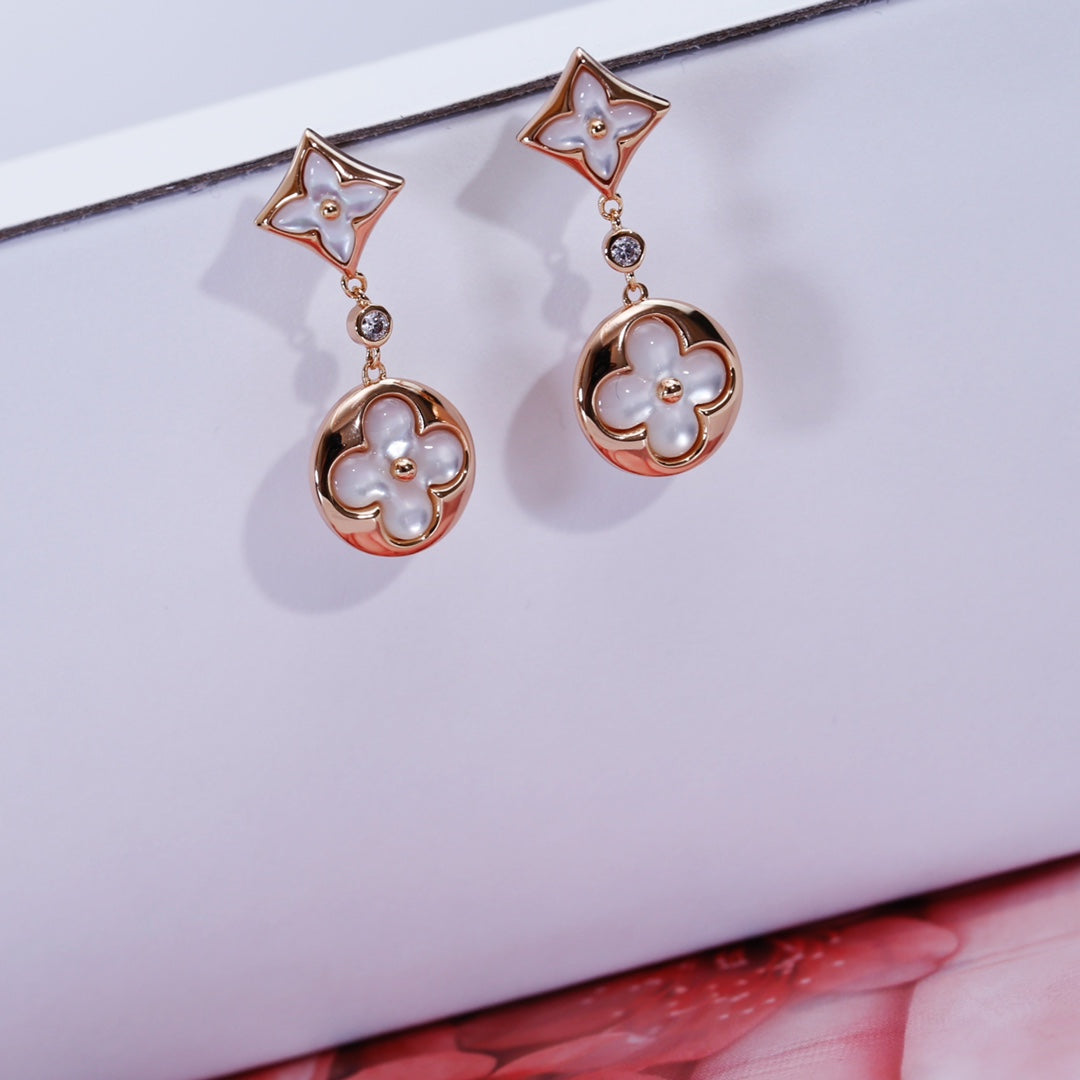 [NOVO]Ohrringe mit Stern und Sonne in Rosa-Gold