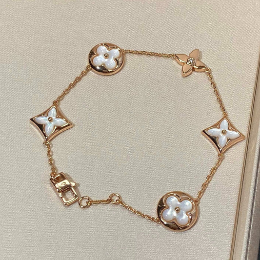 [NOVO]Armband mit Stern und Sonne, 5 Motiven, Mopp, rosa-golden