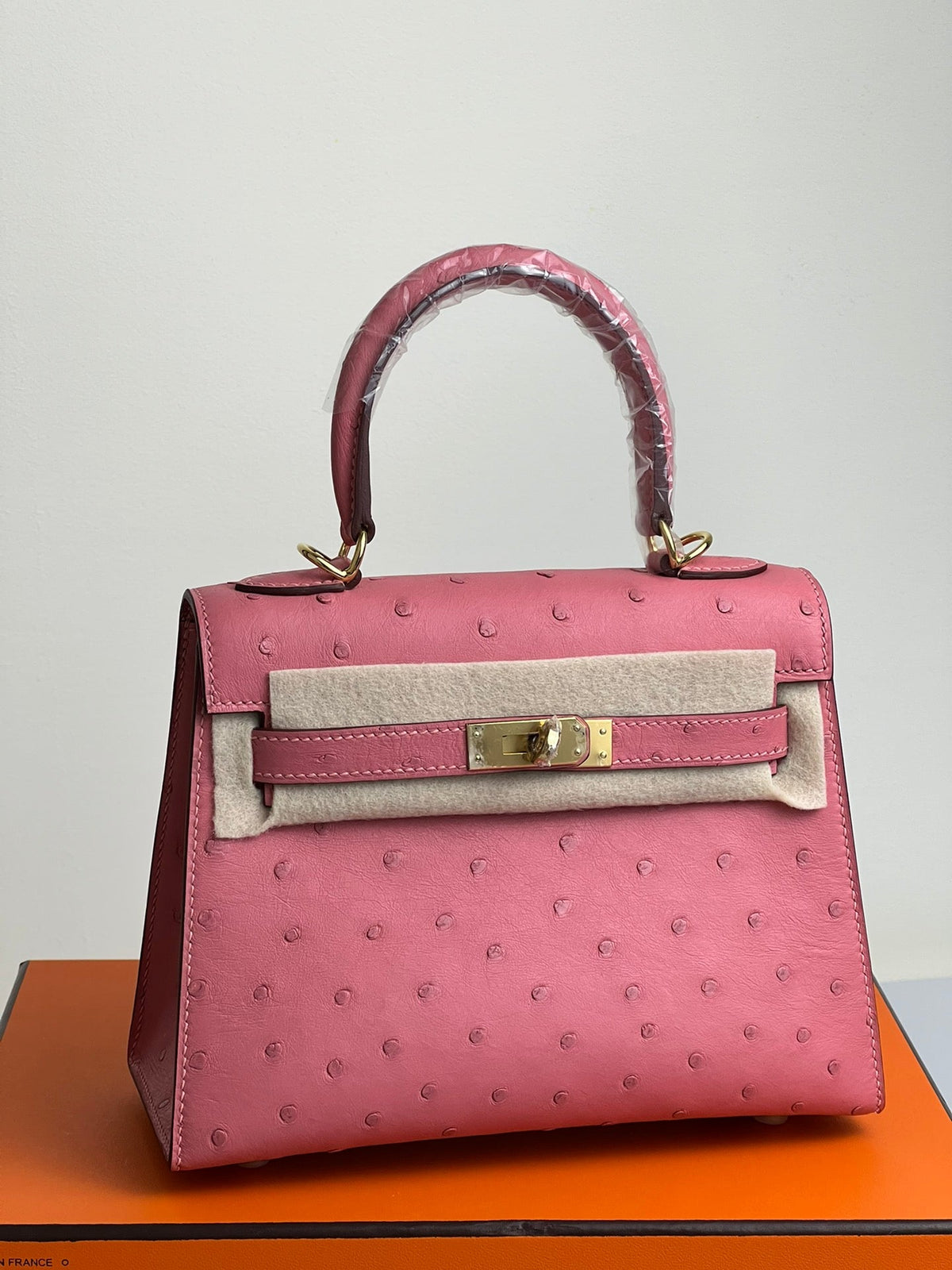 KELLY BAG 20 IN ROUGE PINK OSTRICH LEATHER WITH GOLD HARDWARE (MADE - TO - ODER)