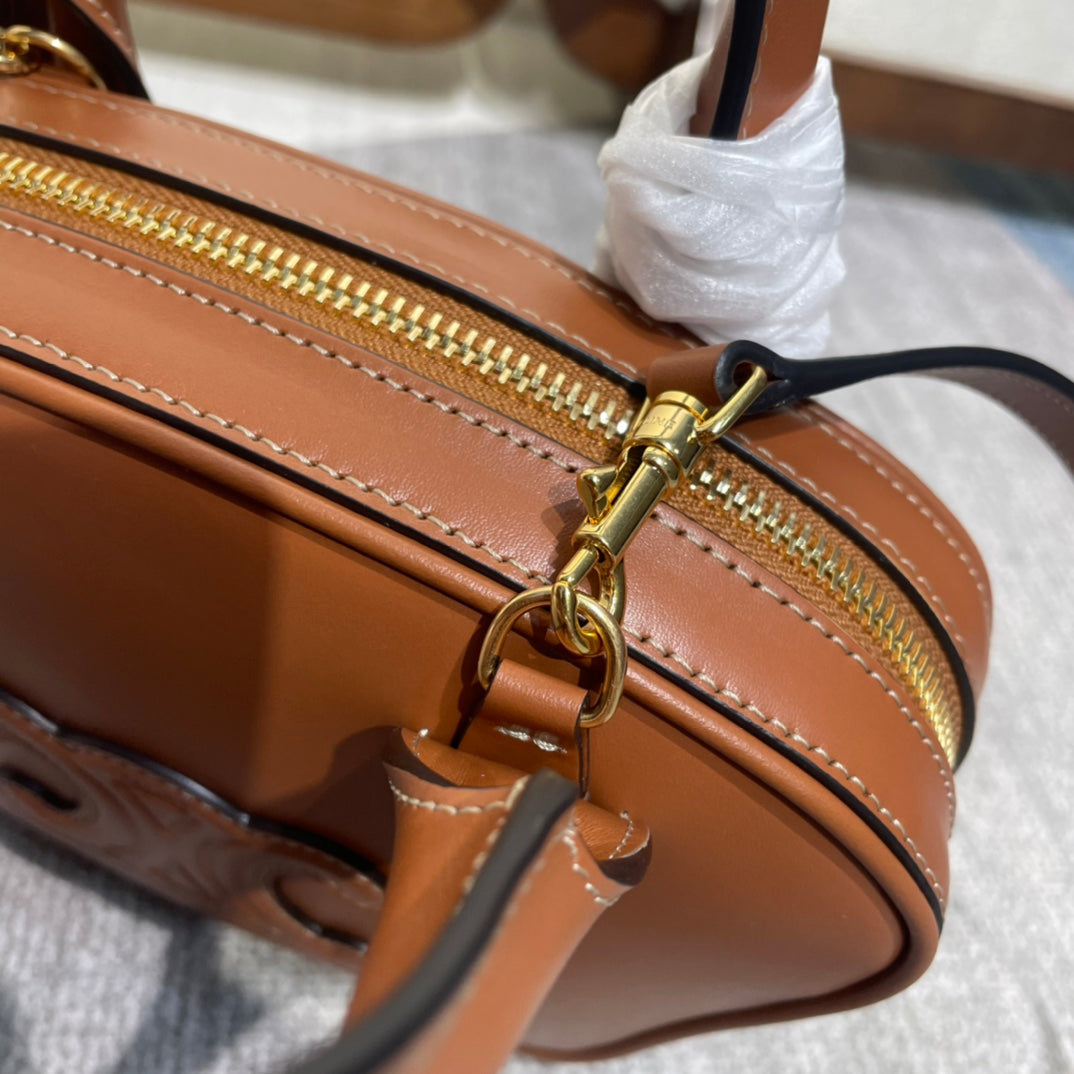 TRIOMPHE TOP HANDLE BAG 20 IN BRONZE BROWN CALFSKIN