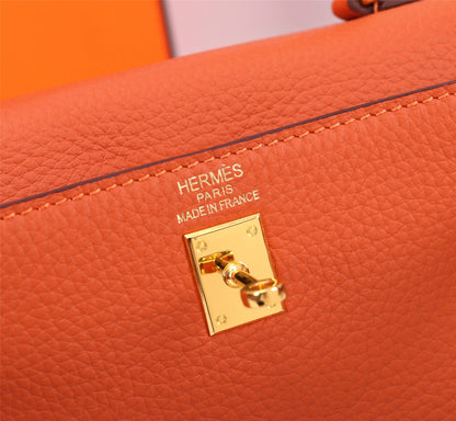 HM KELLY BAG 25 ORANGE TOGO GOLD HARDWARE