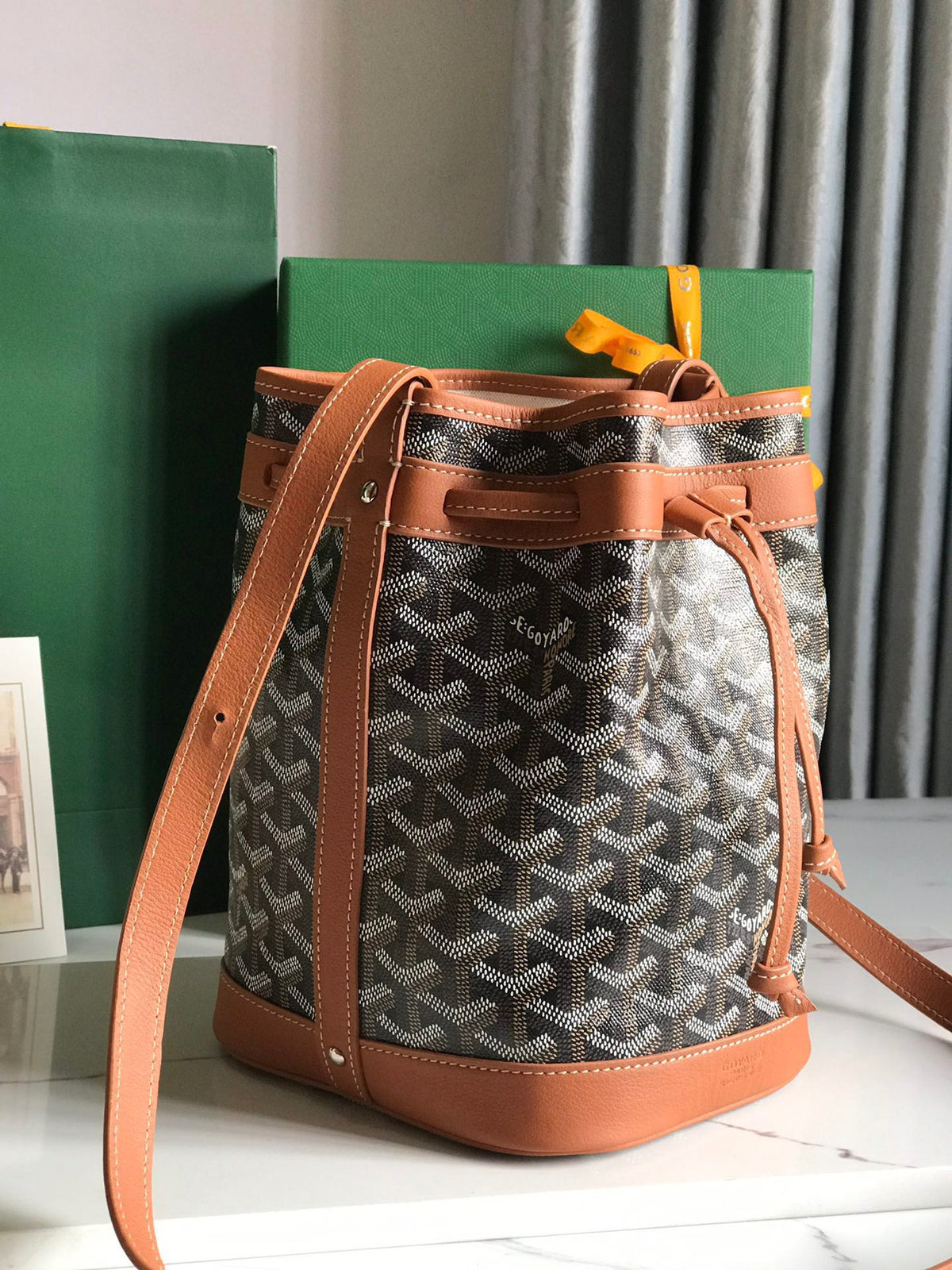 PETIT FLOT BUCKET BAG 22 IN BLACK GOYARDINE CANVAS AND TAN LAMBSKIN TRIM