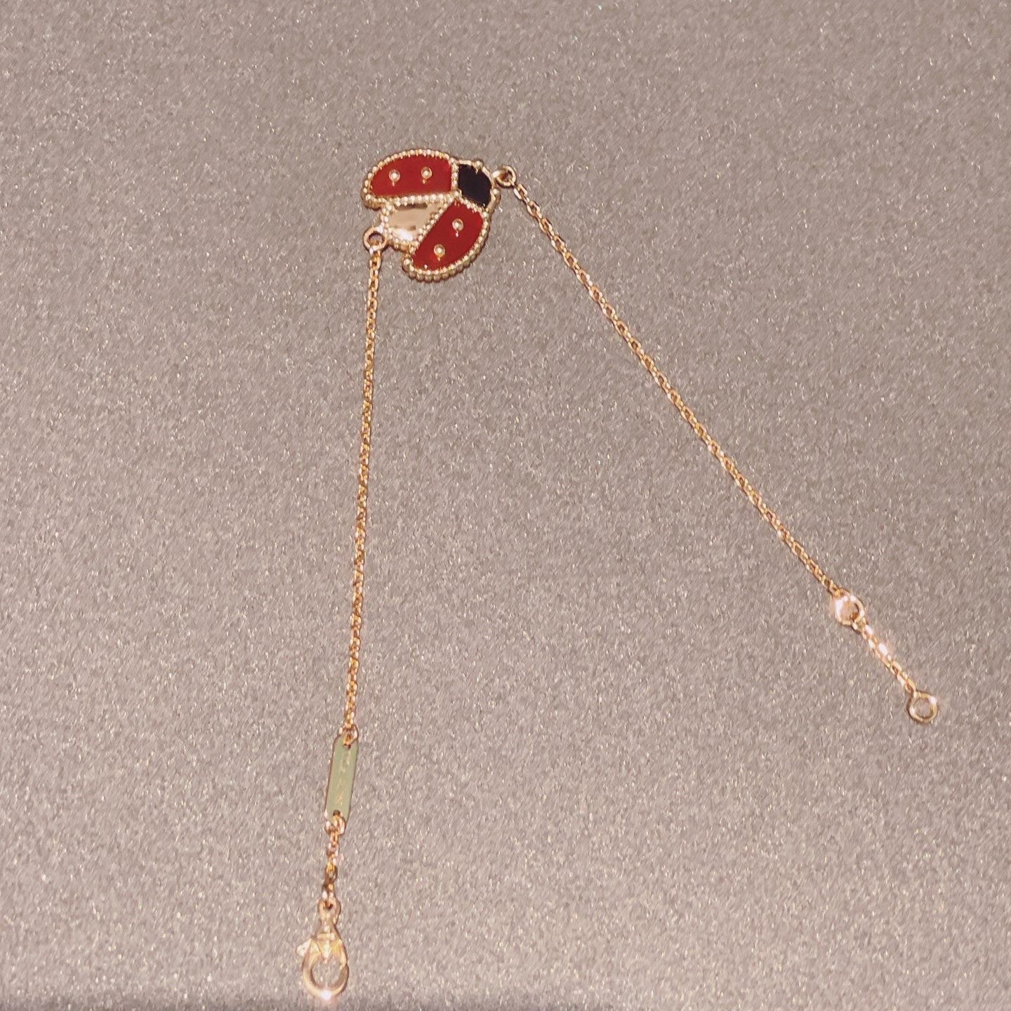 [NOVO] Armband mit Glücksfedermotiv 1, rosa-golden